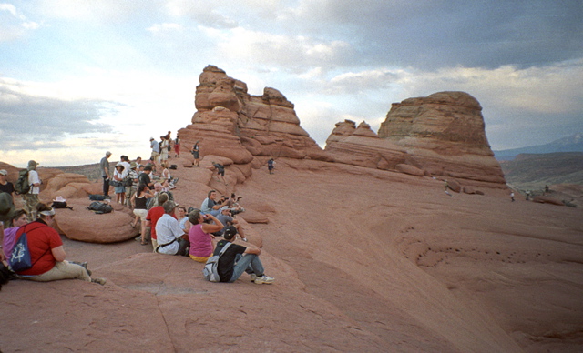 Arches National Park Hikers Waiting at Delicate Arch Photo